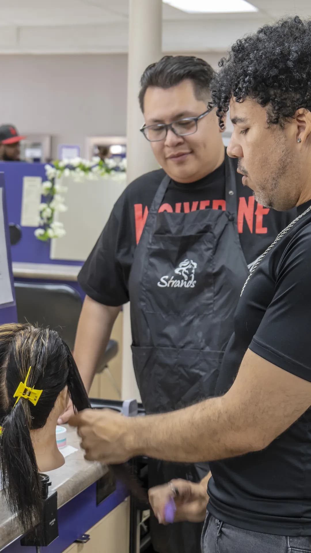 Young stylist with extension color ring samples