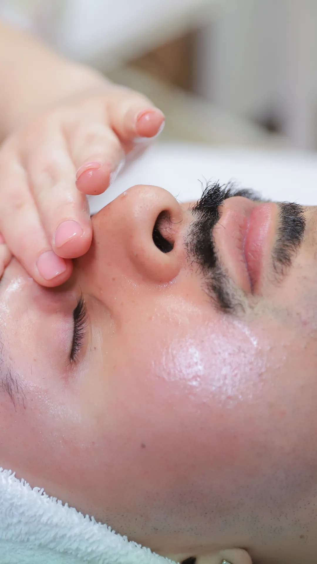Experienced esthetician performing facial treatment