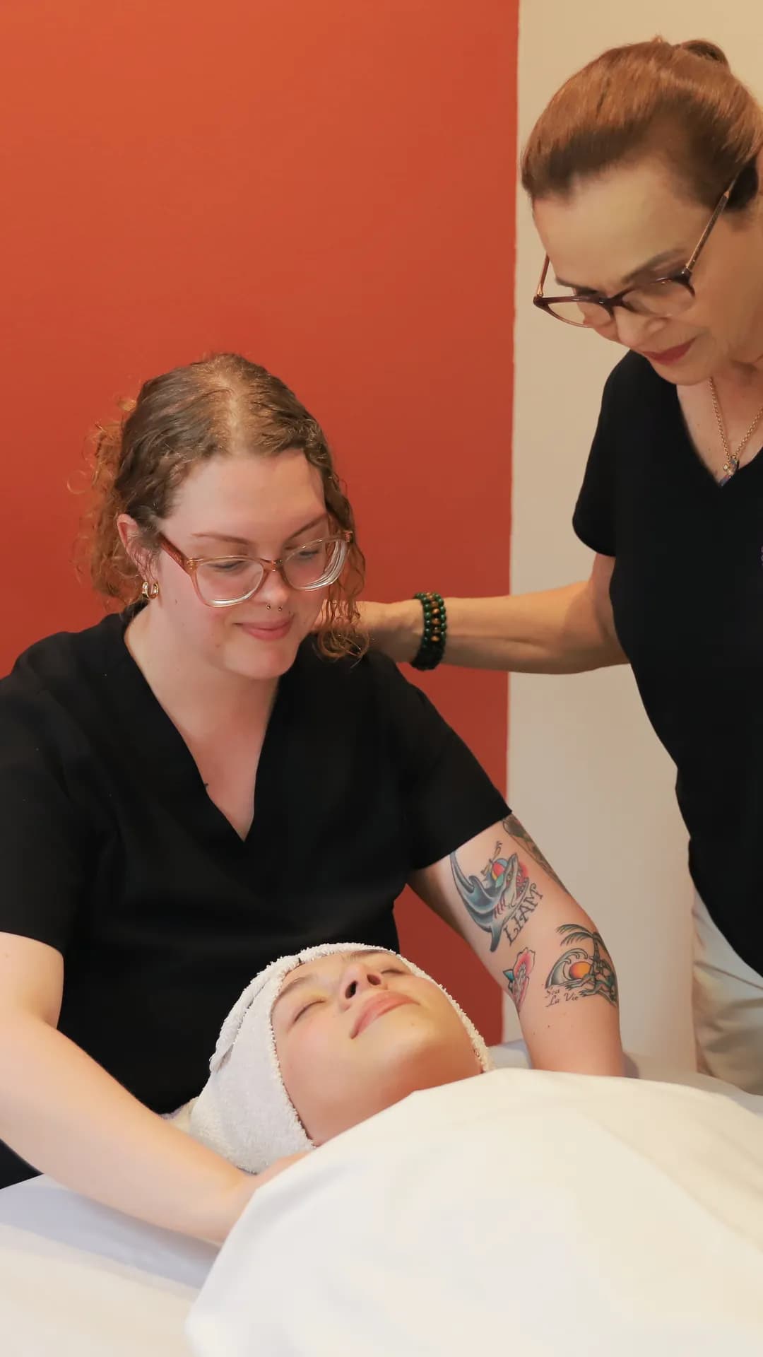 Young esthetician learning microdermabrasion