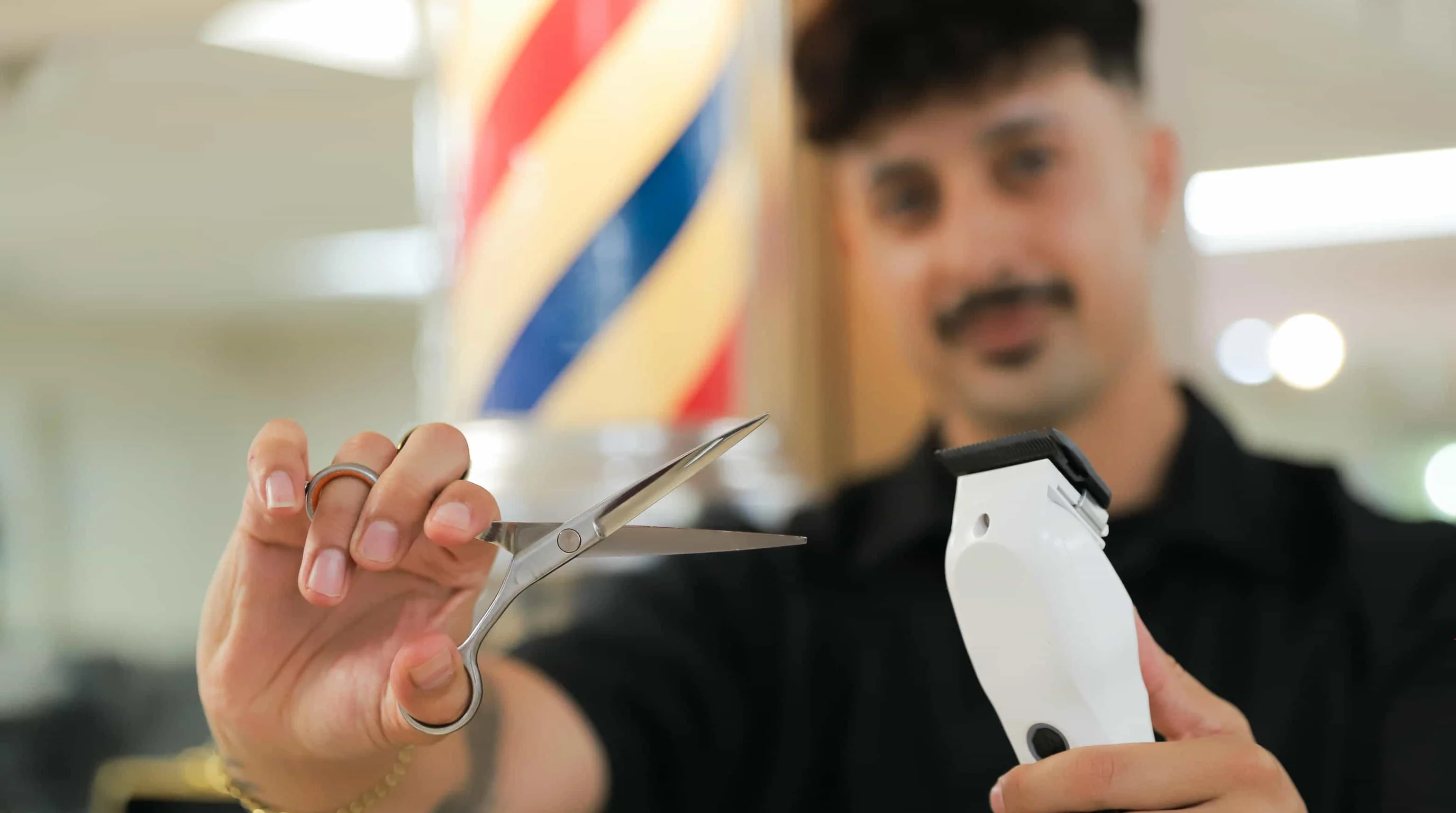 Barber working on client in classic barbershop