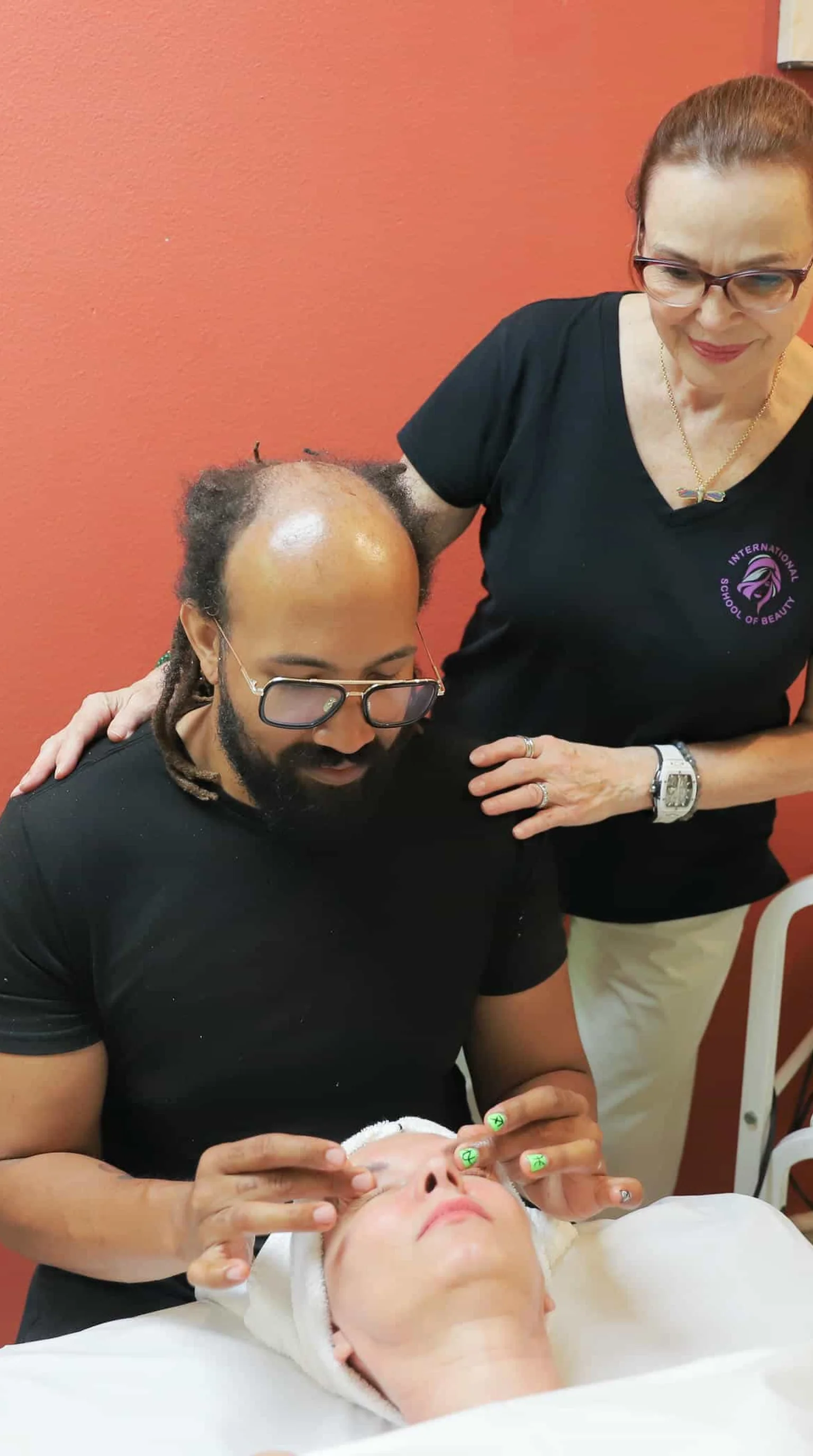 Esthetician performing facial treatment on client